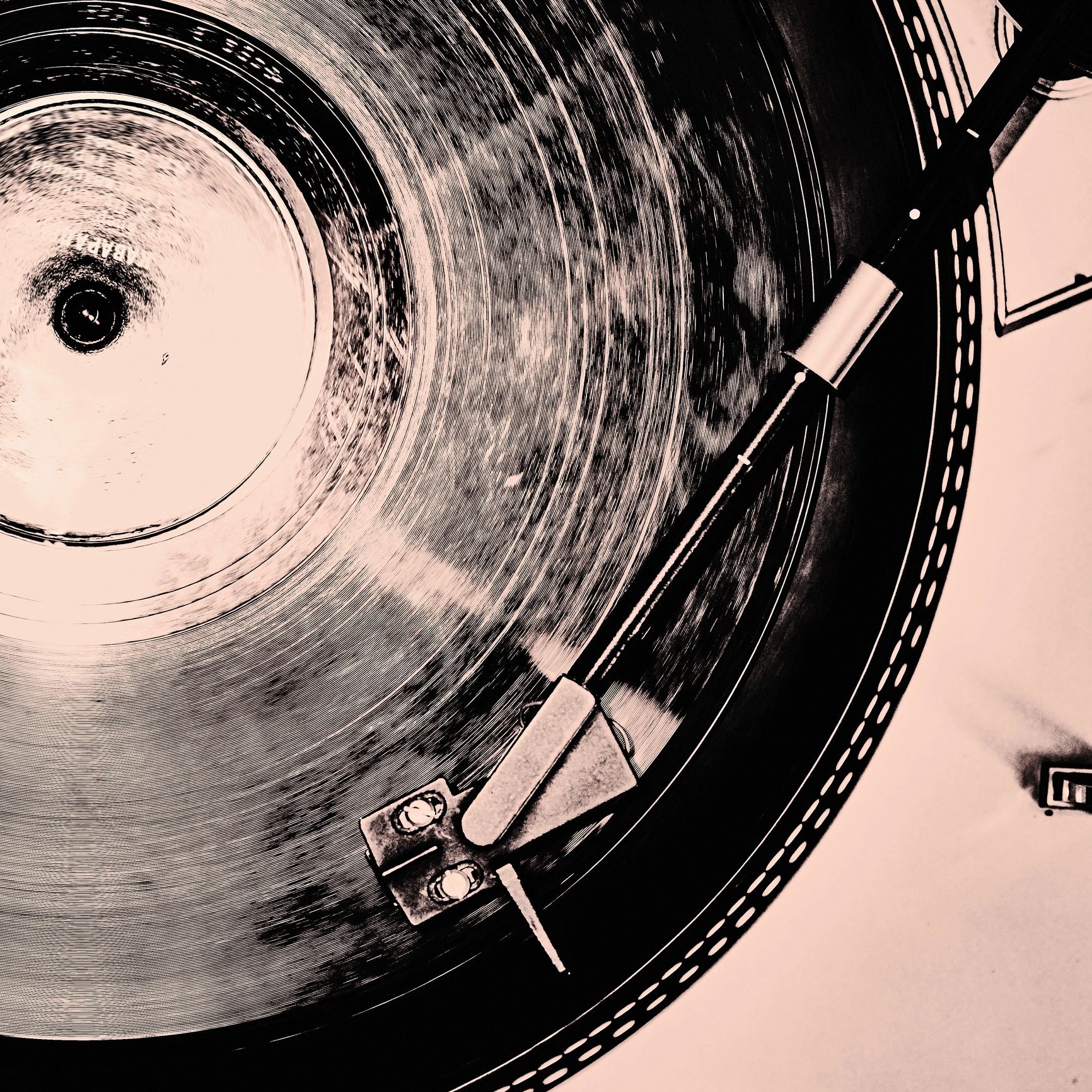 Laser-engraved cork record player mat on a neutral background