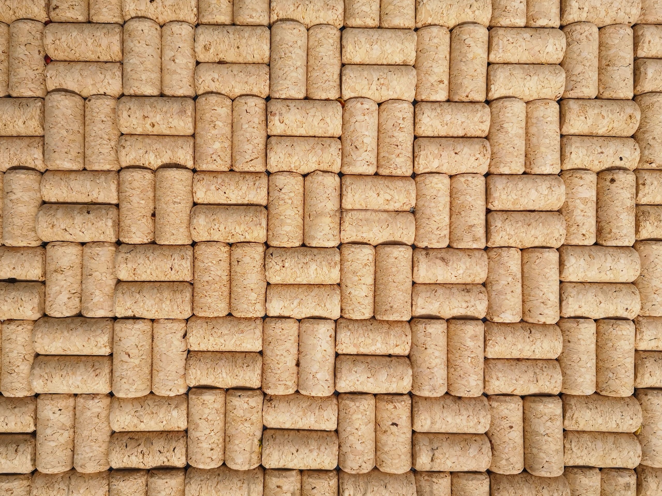 Pattern of unused wine corks forming a textured background